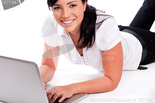 Image of Young happy business woman working with the laptop
