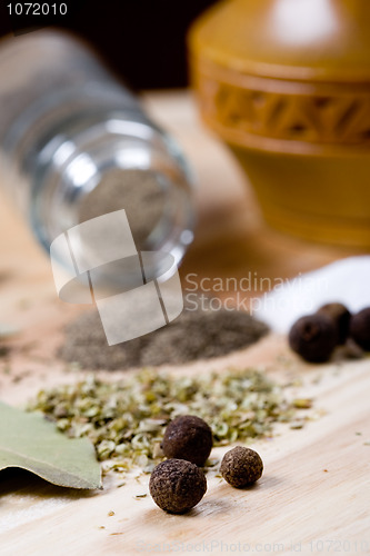 Image of spices: pepper, salt, bay leaves and herbs