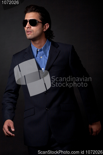 Image of portrait of young fashion model wearing sunglasses