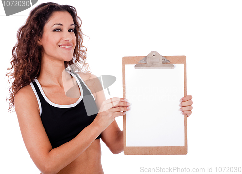 Image of Fitness woman showing a blank clip board