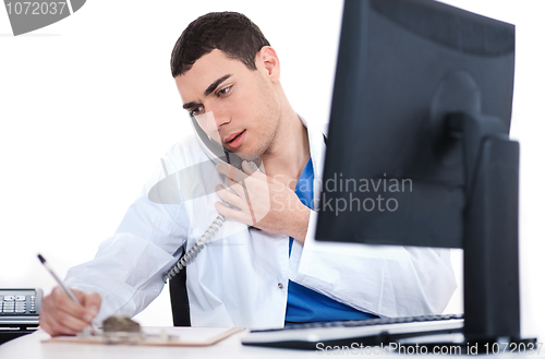 Image of Doctor making notes of the conversation over phone