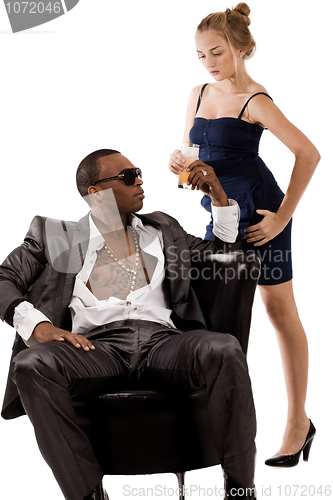 Image of Young lady gives juice to the black man