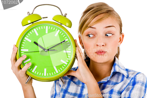 Image of Girl giving funny expression and holding the alarm