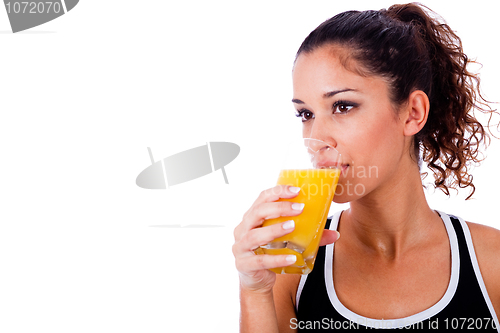 Image of fitness girl drinking fresh juice