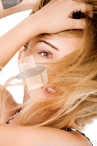 Image of Young model with beautiful hair covered her face