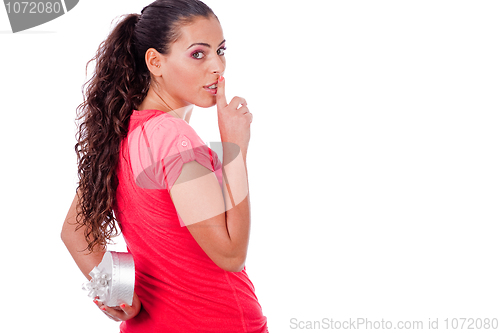 Image of Cute girl hides a heart symbol on her back