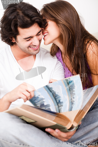 Image of cute couple embracing in living room