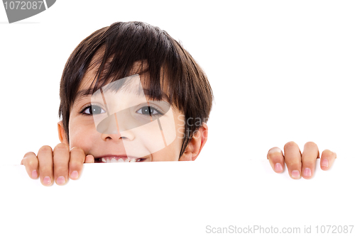 Image of Young boy lifting his head out of the blank board
