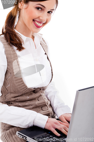 Image of Cute girl typing on laptop