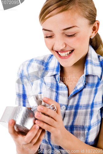 Image of Young women open a heart symbol gift box with smile