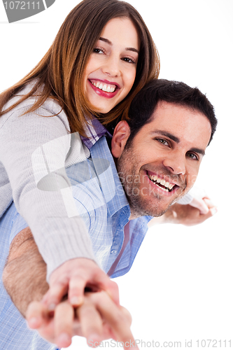 Image of Young man giving piggy back ride to his lover