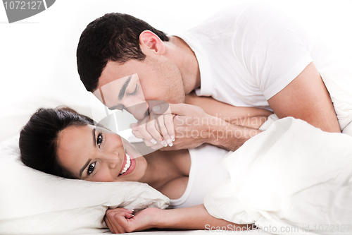 Image of Intimate young couple in bed