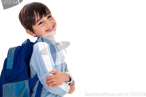 Image of Happy young boy ready for school with his bag
