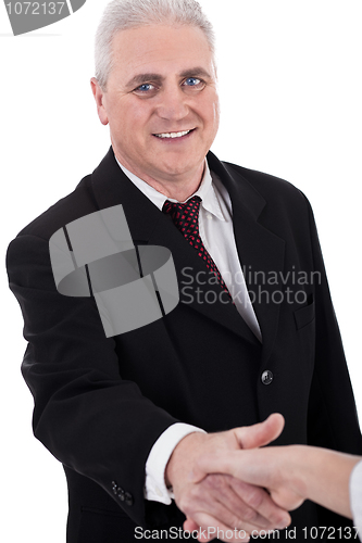 Image of Senior business man welcomes his client