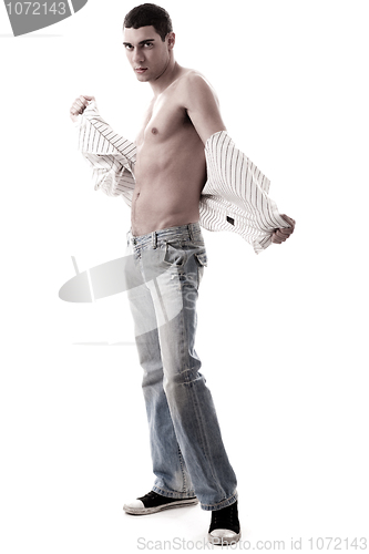Image of Trendy model show his muscles in jean