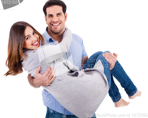 Image of Cheerful young couple piggybacking