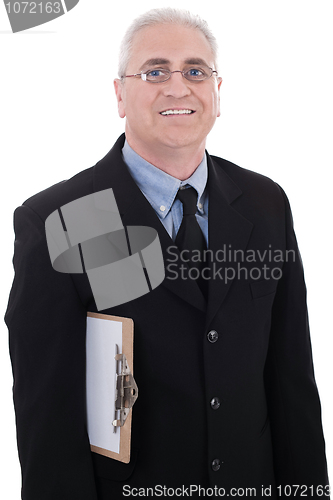 Image of Mature business man holding a clipboard