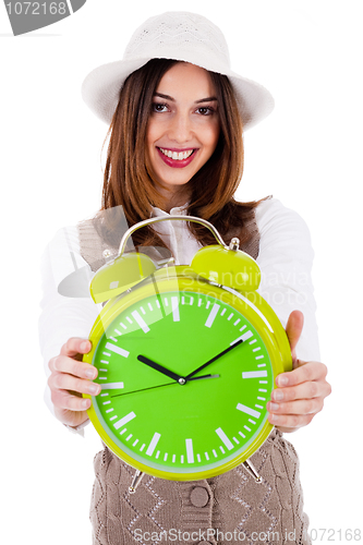 Image of Beautiful young model with hat and showing clock