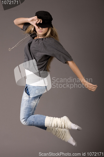 Image of Young women jumping during her dance