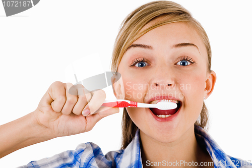 Image of Young girl the brush her tooth