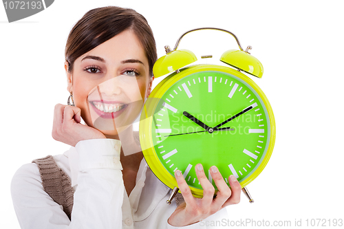 Image of attractive young model smiling and holding the clock