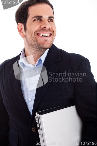 Image of Young worker carrying a laptop