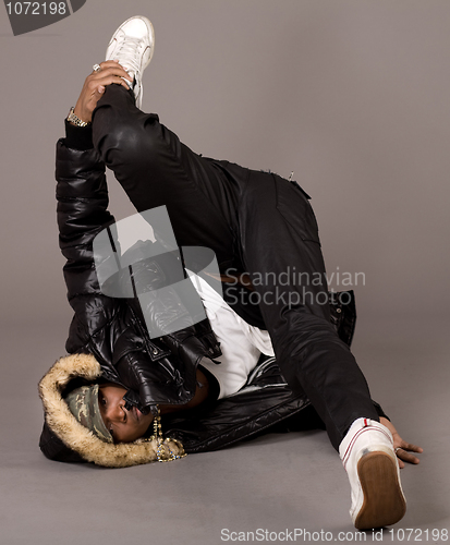 Image of Black american performing floor movements in dance