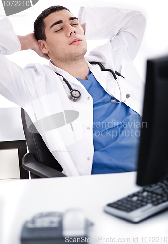 Image of Young male doctor relaxing at his cabin