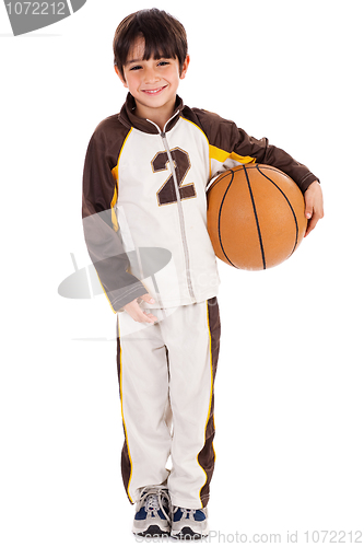 Image of Adorable young kid in his sports dress with ball