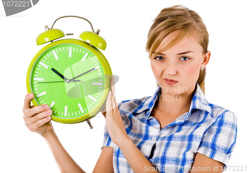Image of Girl giving funny expression and holding the alarm