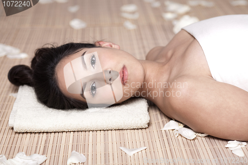 Image of Young beautiful lady receiving spa treatment