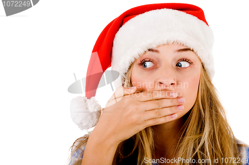 Image of Closeup of young women covering her mouth with both hands