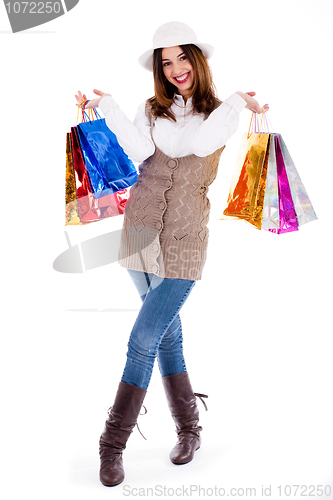 Image of Young girl happy with lot of shopping bags