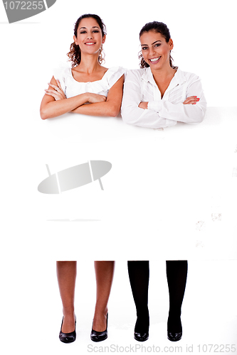 Image of Full length of young business women's with their hands folded