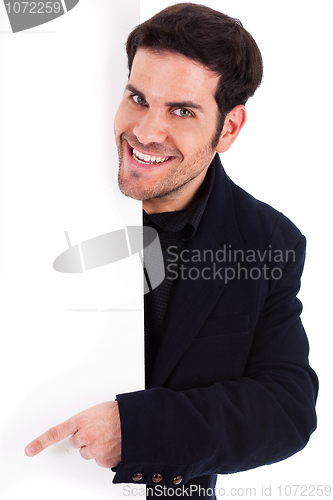 Image of Portrait of a business man pointing at the blank board