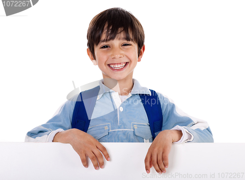 Image of Smiling young boy behind the blank board