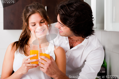 Image of youn couple cheersing