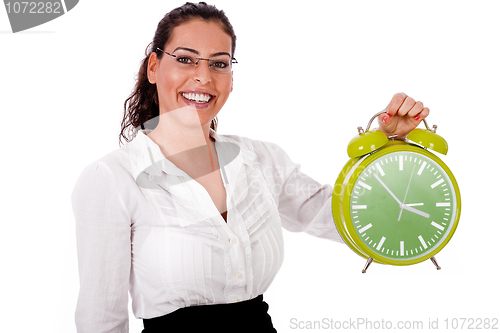 Image of Young business woman showing a green colour clock