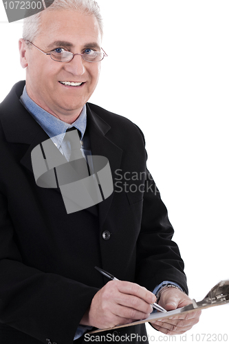 Image of Portrait of smiling business man writing on pad