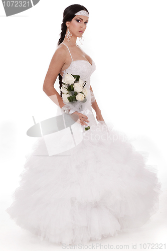 Image of Isolated young trendy bride with bouquet