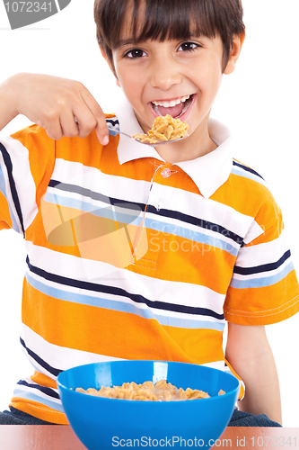 Image of Young boy having his breakfast