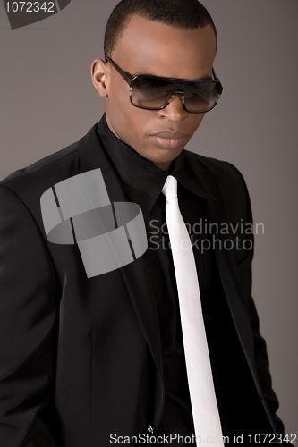 Image of Serious black business man with sunglasses