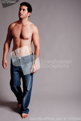 Image of Topless Masculine man looking the right corner