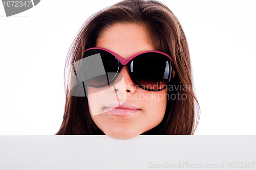 Image of closeup of beautiful young women showing blank board stright view head