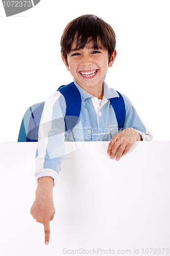 Image of Young school boy showing hins fingers down from behind the board