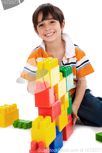 Image of Young boy playing with building blocks