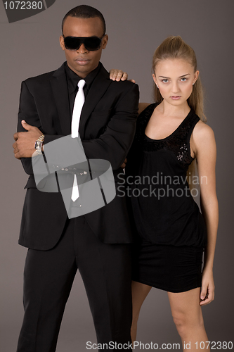 Image of young attractive women and handsome young african man