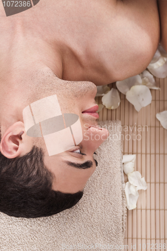 Image of Man relaxing in spa salon