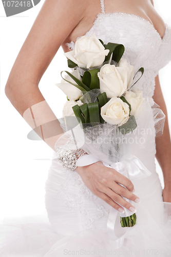 Image of Bride with bunch of white roses