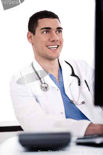 Image of Smiling young doctor at his office